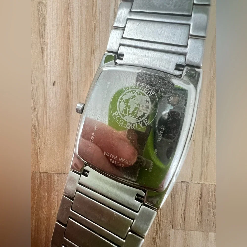 Citizen eco-drive rectangular black dial silver tone solar dress watch